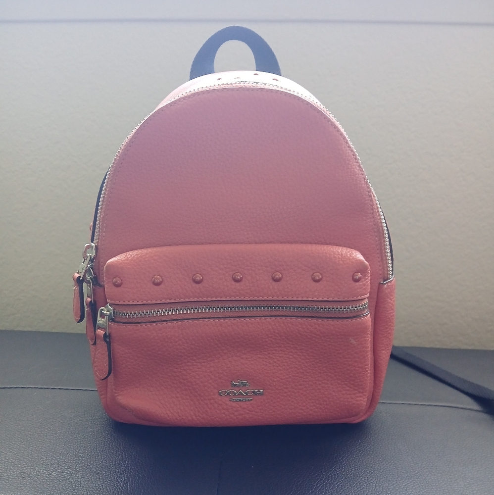 Coach Mini Charlie Pebbled Leather Coral Backpack.